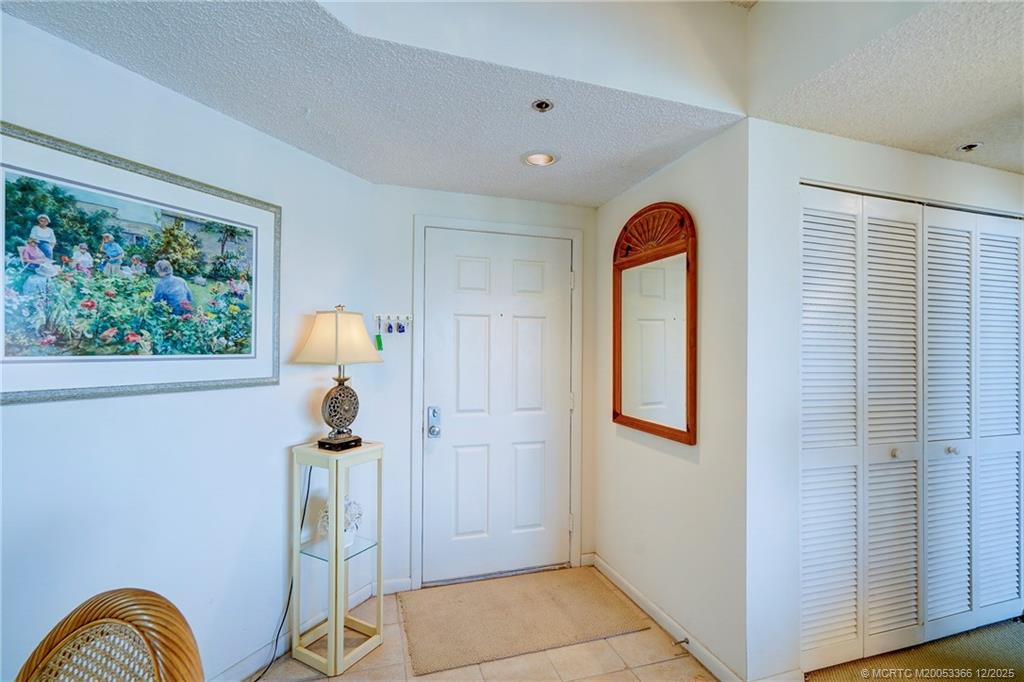 221 Northeast Plantation Road, Unit 407 Stuart, FL 34996 - Photo 19 of 42 a front view of a house with garden