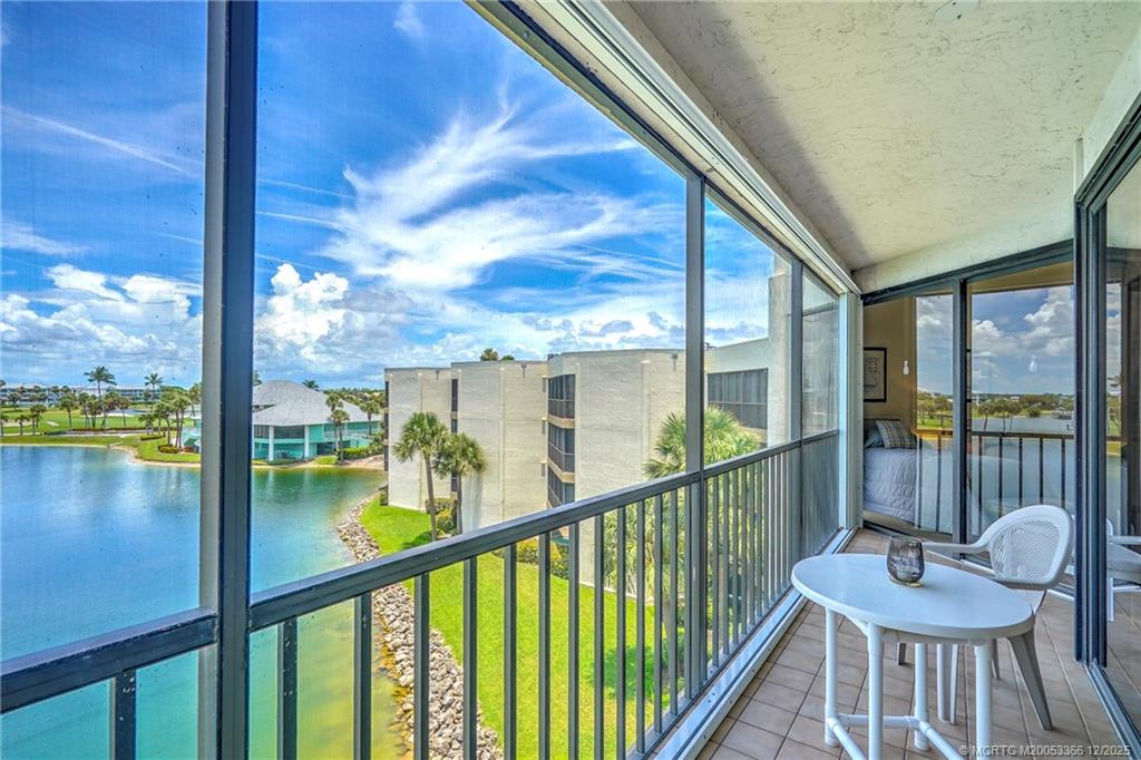 221 Northeast Plantation Road, Unit 407 Stuart, FL 34996 - Photo 28 of 42 a view of a balcony with lake view