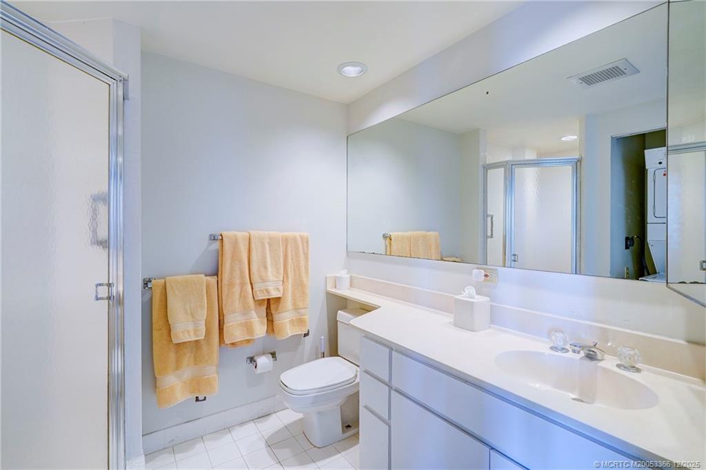 221 Northeast Plantation Road, Unit 407 Stuart, FL 34996 - Photo 30 of 42 a bathroom with a sink toilet and shower