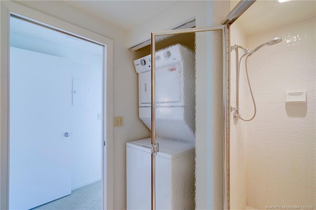 221 Northeast Plantation Road, Unit 407 Stuart, FL 34996 - Photo 31 of 42 a bathroom with a shower and a glass door