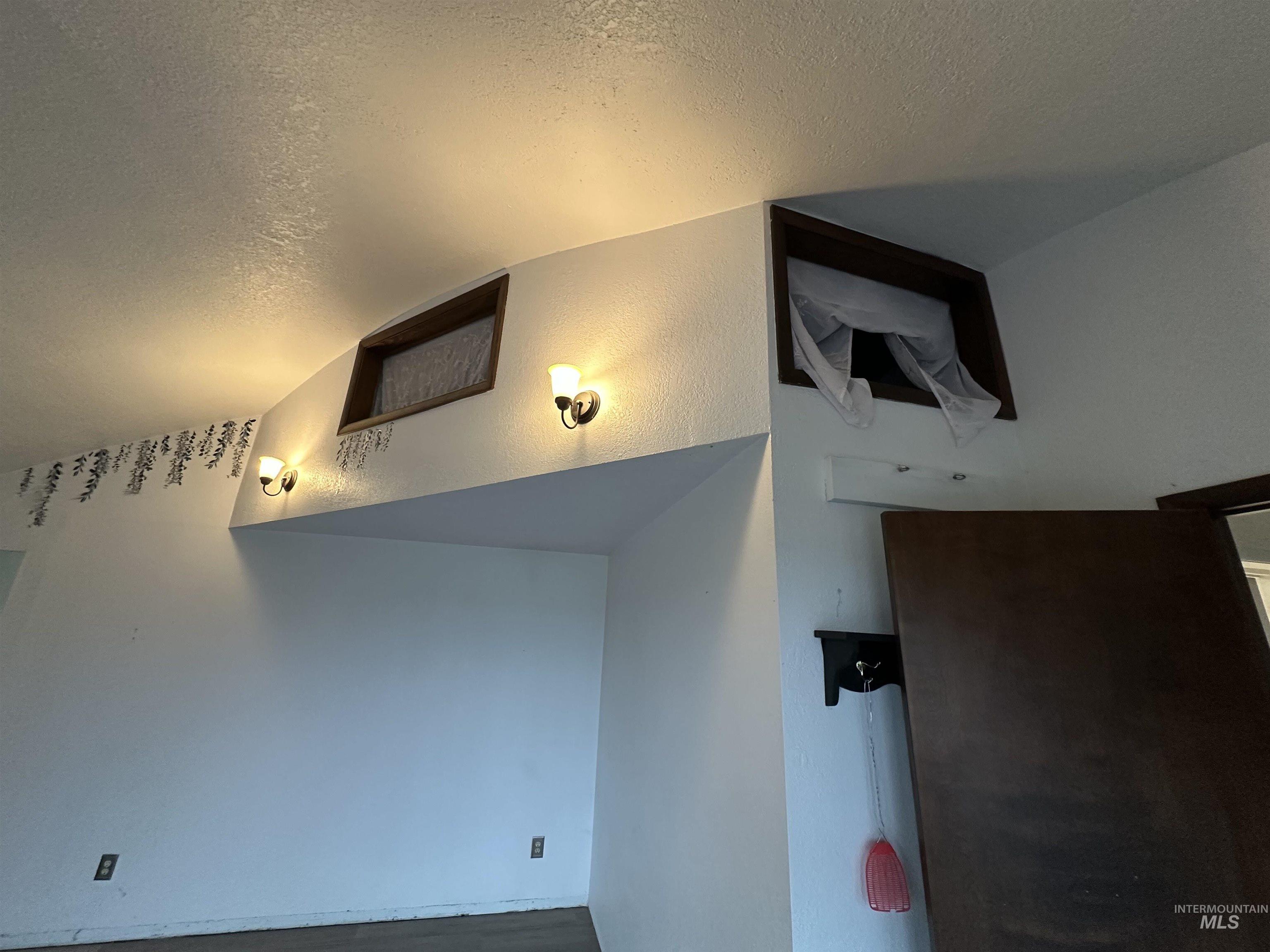 5860 Akron Road New Plymouth, ID 83655 - Photo 14 of 33 Staircase featuring a textured ceiling and a textured wall