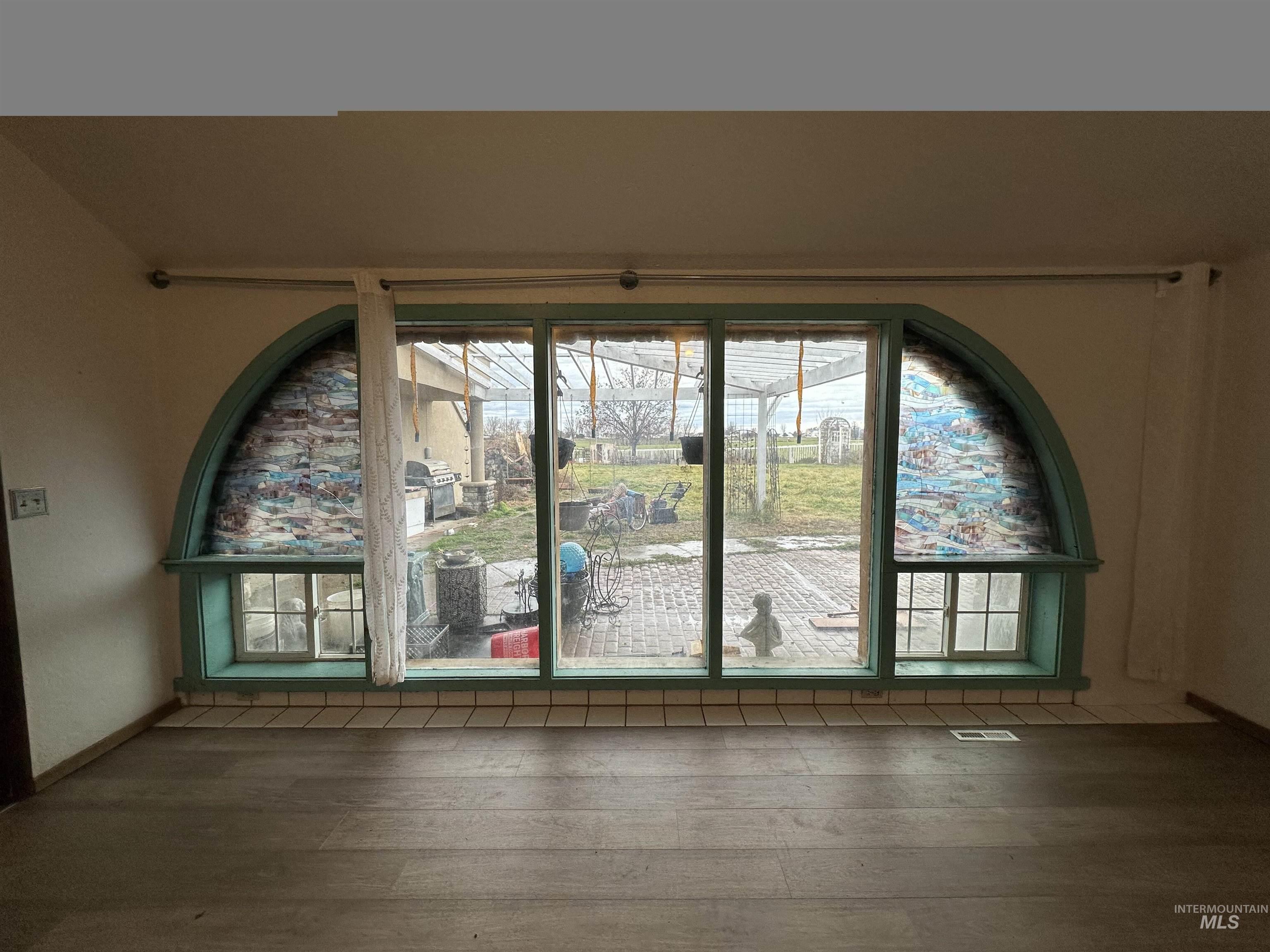 5860 Akron Road New Plymouth, ID 83655 - Photo 16 of 33 Empty room featuring dark wood-type flooring