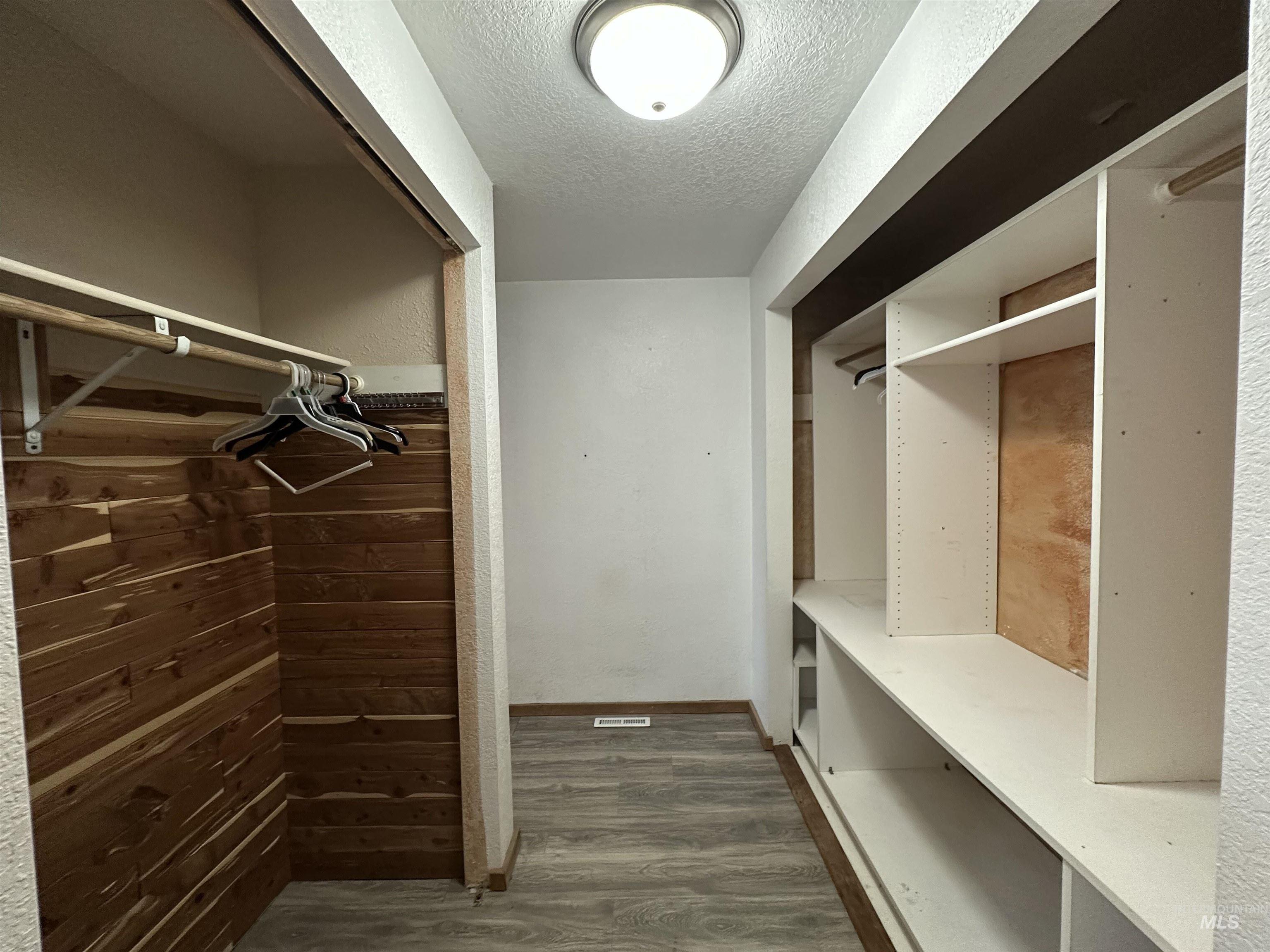 5860 Akron Road New Plymouth, ID 83655 - Photo 17 of 33 Spacious closet featuring dark wood finished floors