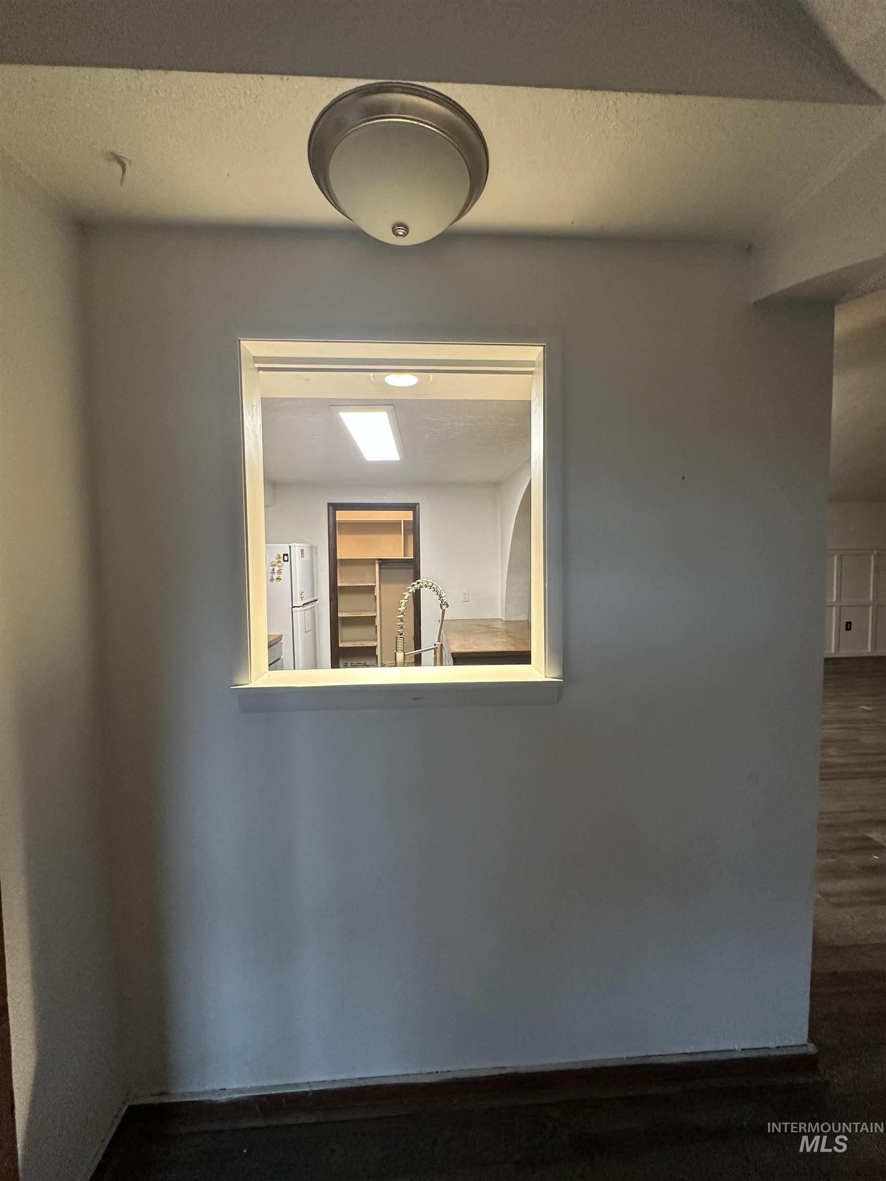 5860 Akron Road New Plymouth, ID 83655 - Photo 21 of 33 Unfurnished room with a textured ceiling and dark wood finished floors