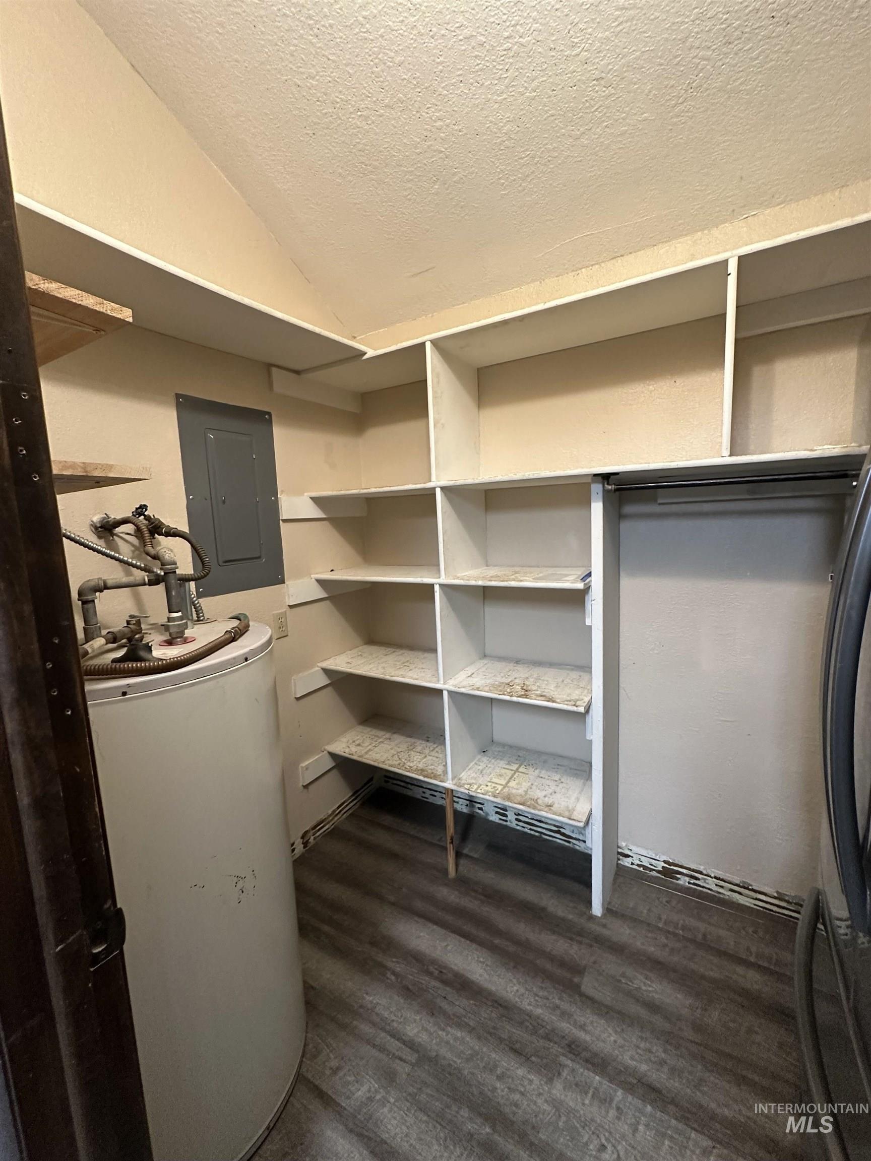 5860 Akron Road New Plymouth, ID 83655 - Photo 9 of 33 Storage area featuring electric panel and water heater