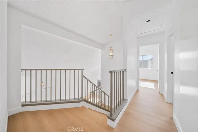a view of a hallway with a white walls
