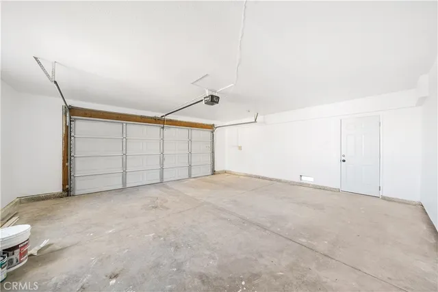 a view of a storage & utility room with two washing machine
