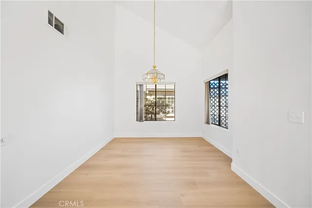 a view of an empty room with windows