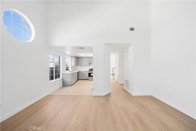 a view of a kitchen with wooden floor
