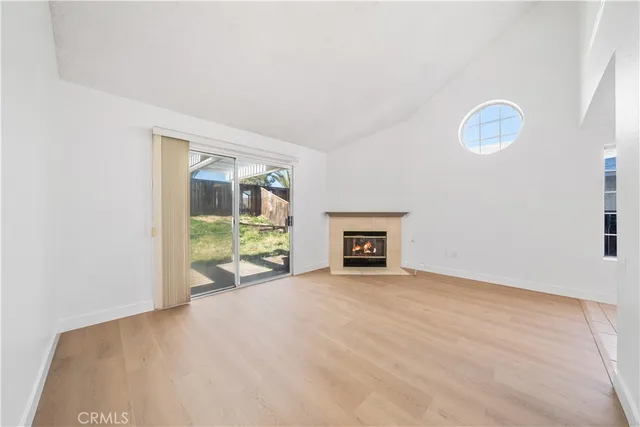 an empty room with floor to ceiling window