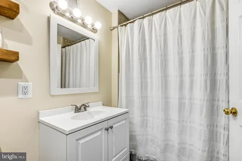 a bathroom with a sink a vanity and a mirror
