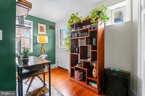 a view of a workspace with furniture