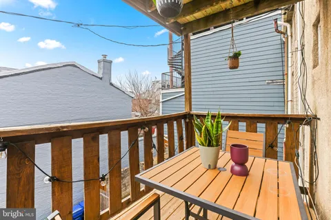 a view of a balcony with wooden floor