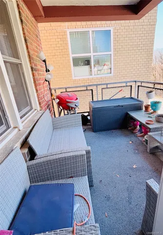 a balcony with furniture and window