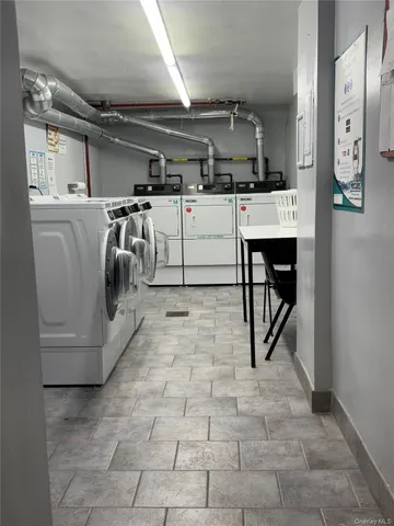 a utility room with washer and dryer