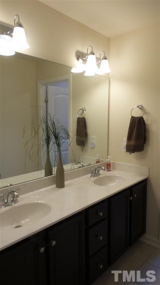 1151 Alsace Drive Apex, NC 27502 - Photo 16 of 25 Full Bathroom features double vanity, tile floors and separate shower / potty room!