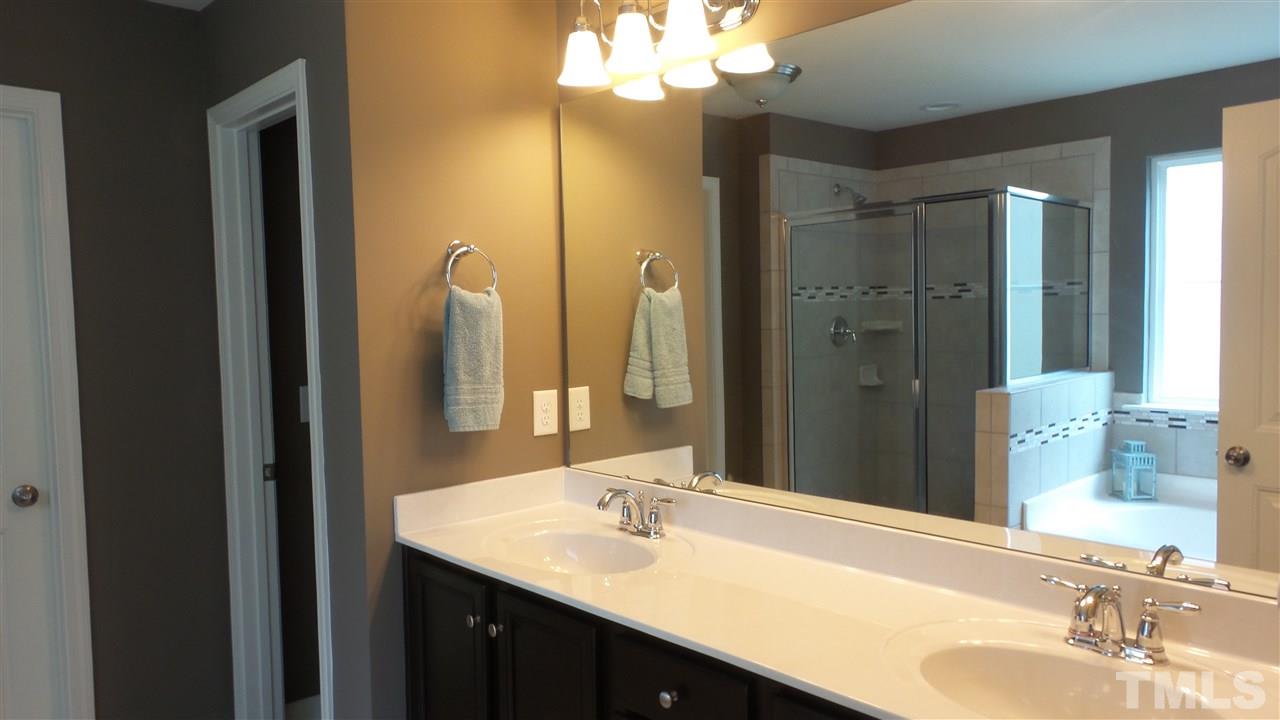 1151 Alsace Drive Apex, NC 27502 - Photo 18 of 25 Large master bathroom with tile floor and shower! HUGE walk in closet!