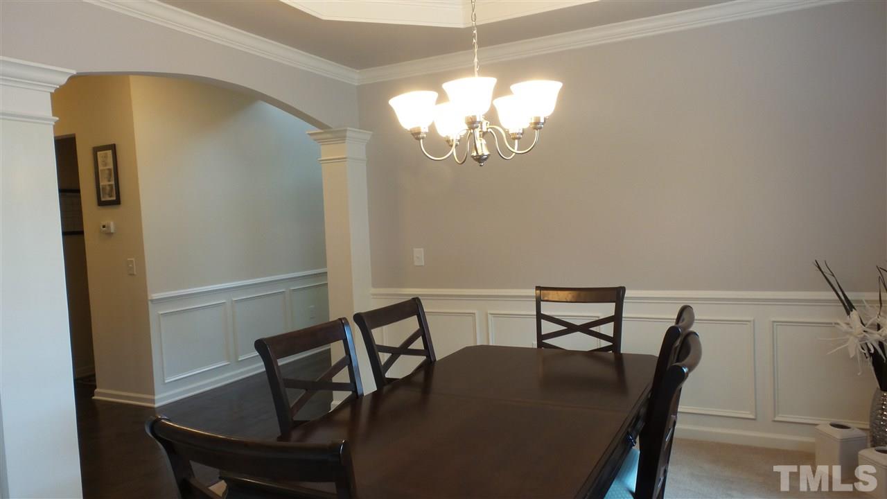 1151 Alsace Drive Apex, NC 27502 - Photo 6 of 25 Gorgeous Dining Room with arched entryway, wainscoting and trey ceilings! Entertain your guest in this beautiful room!