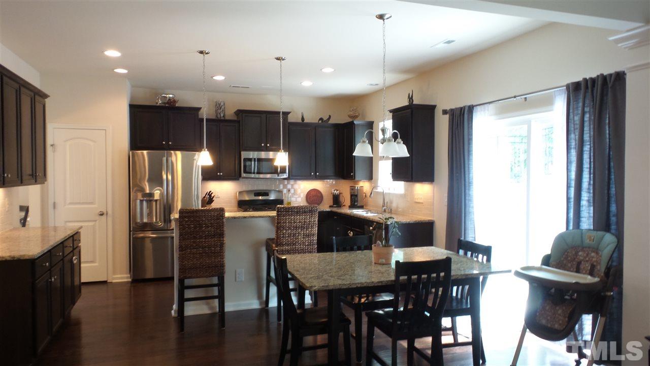 1151 Alsace Drive Apex, NC 27502 - Photo 9 of 25 Kitchen is open to the family room providing a nice "open feel" to the living space!