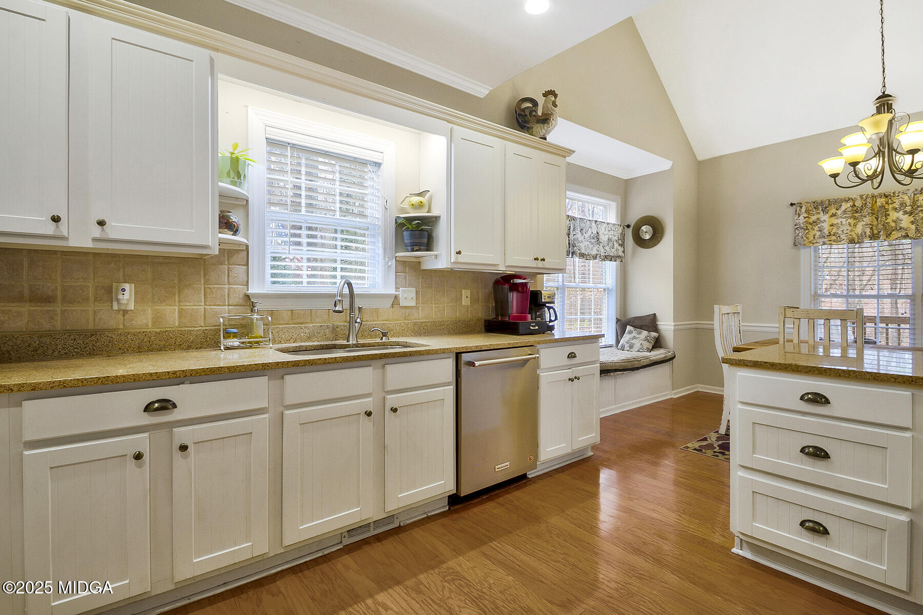 22 Rabon Drive Forsyth, GA 31029 - Photo 12 of 47 a kitchen with granite countertop white cabinets and white appliances