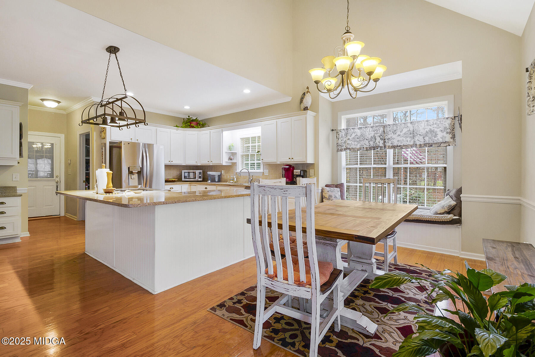 22 Rabon Drive Forsyth, GA 31029 - Photo 14 of 47 a dining room filled with furniture and a chandelier