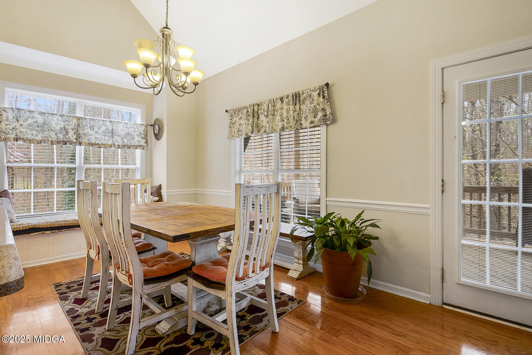 22 Rabon Drive Forsyth, GA 31029 - Photo 15 of 47 a dining room with furniture potted plants and wooden floor