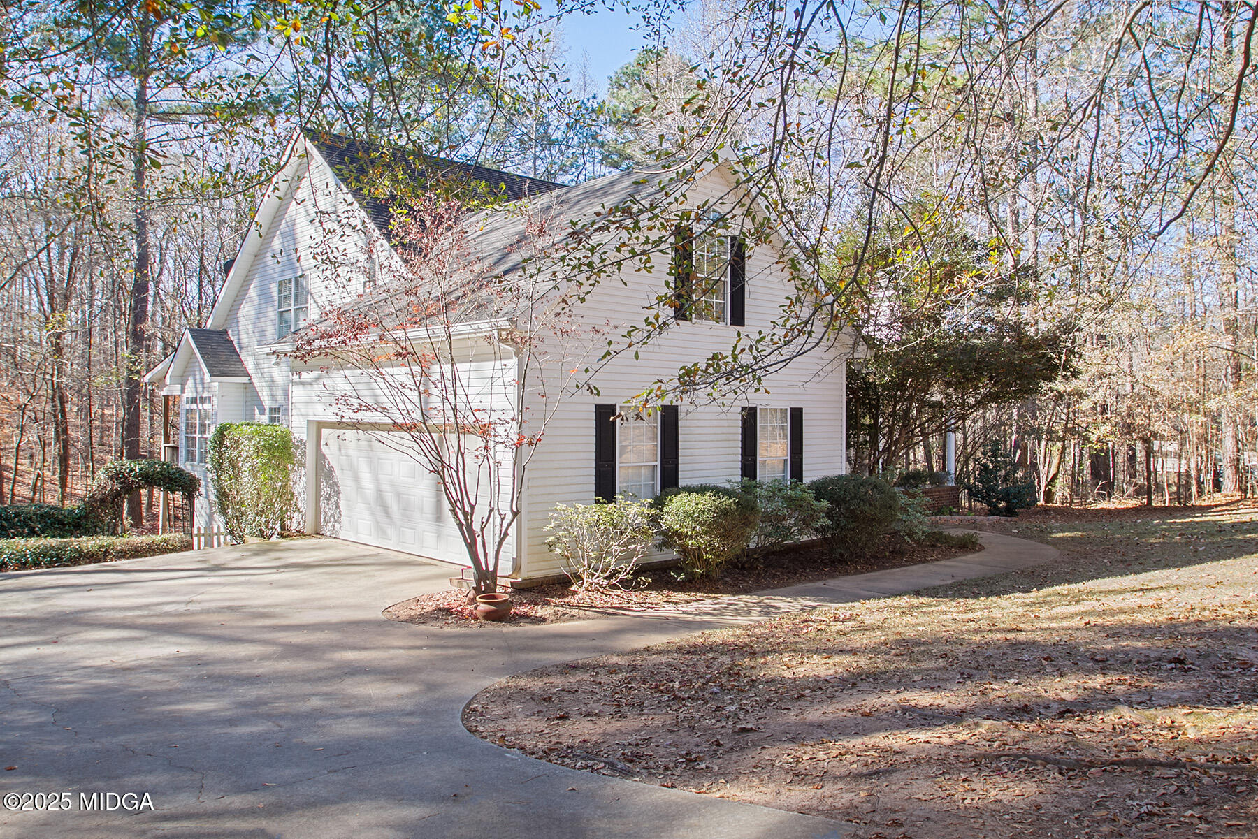 22 Rabon Drive Forsyth, GA 31029 - Photo 2 of 47 a view of a house with a yard next to a road