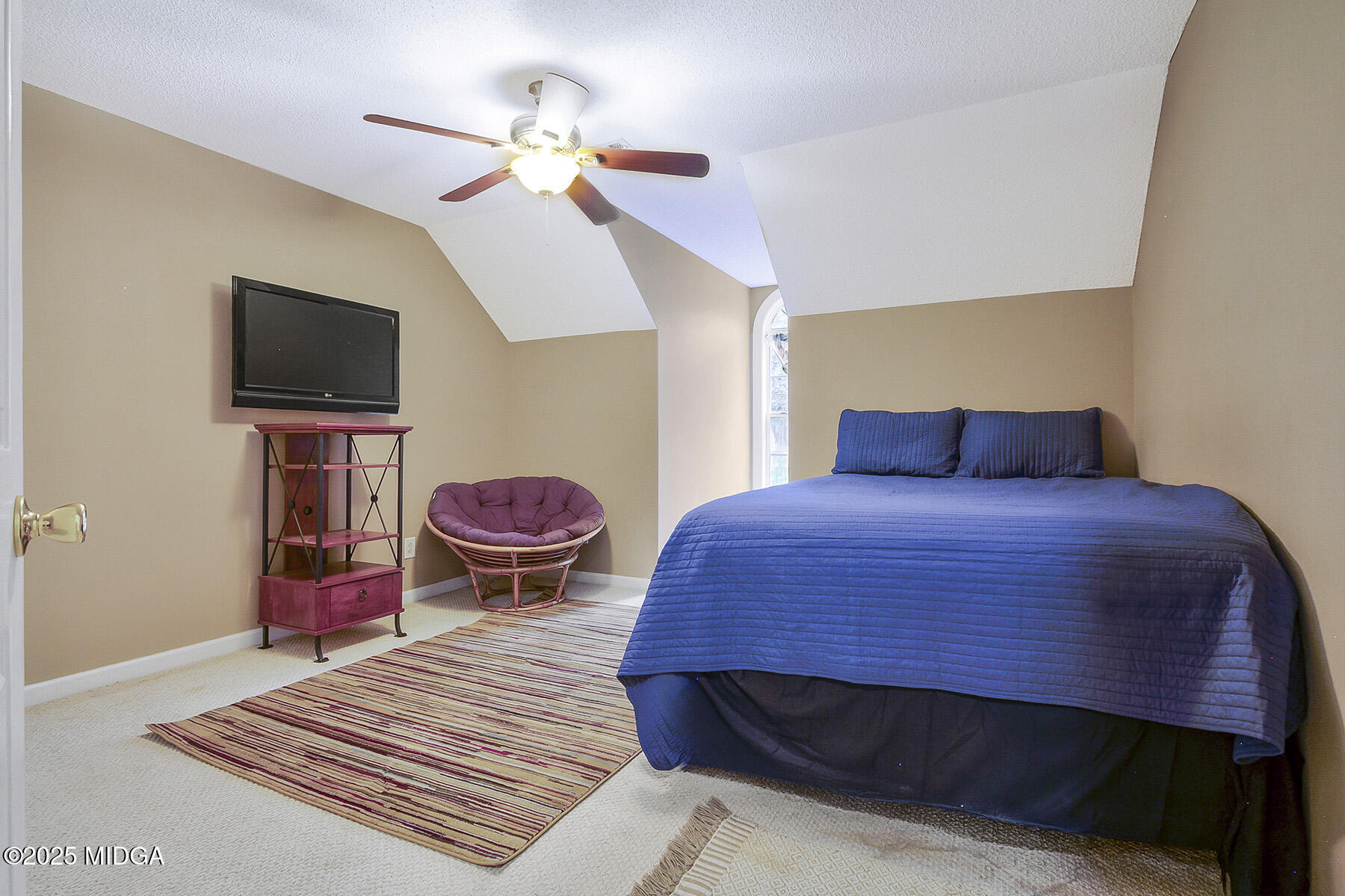 22 Rabon Drive Forsyth, GA 31029 - Photo 24 of 47 a bedroom with a bed and a flat screen tv