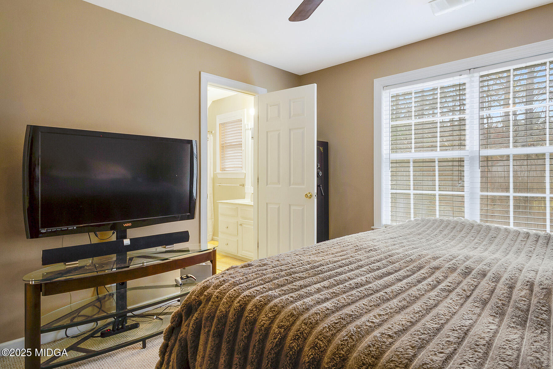 22 Rabon Drive Forsyth, GA 31029 - Photo 27 of 47 a bedroom with a bed and a flat screen tv