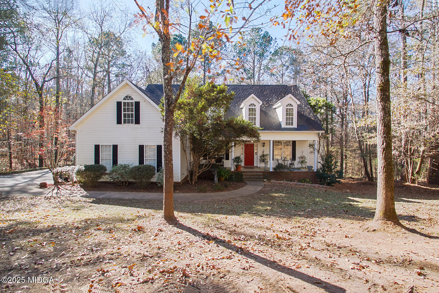 22 Rabon Drive Forsyth, GA 31029 - Photo 3 of 47 a front view of a house with a yard covered in snow