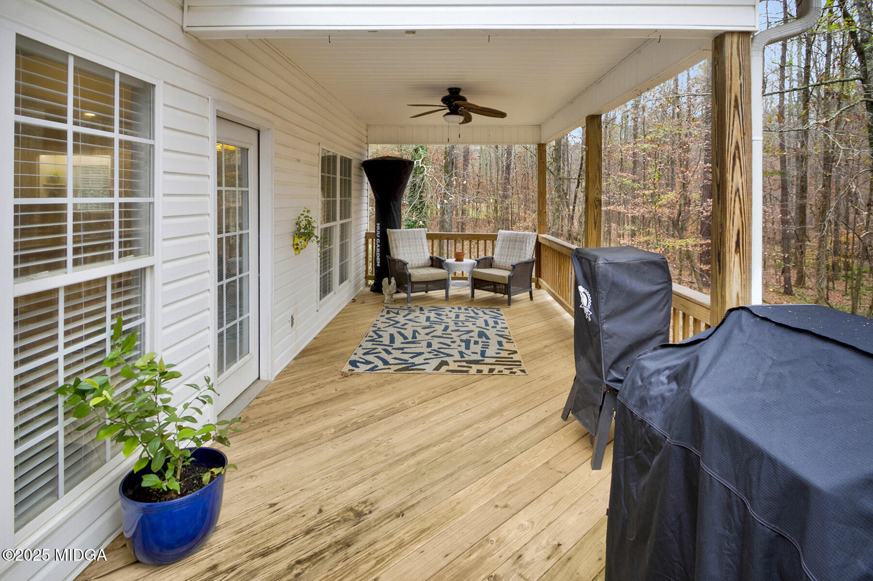 22 Rabon Drive Forsyth, GA 31029 - Photo 39 of 47 a living room filled with furniture and a potted plant