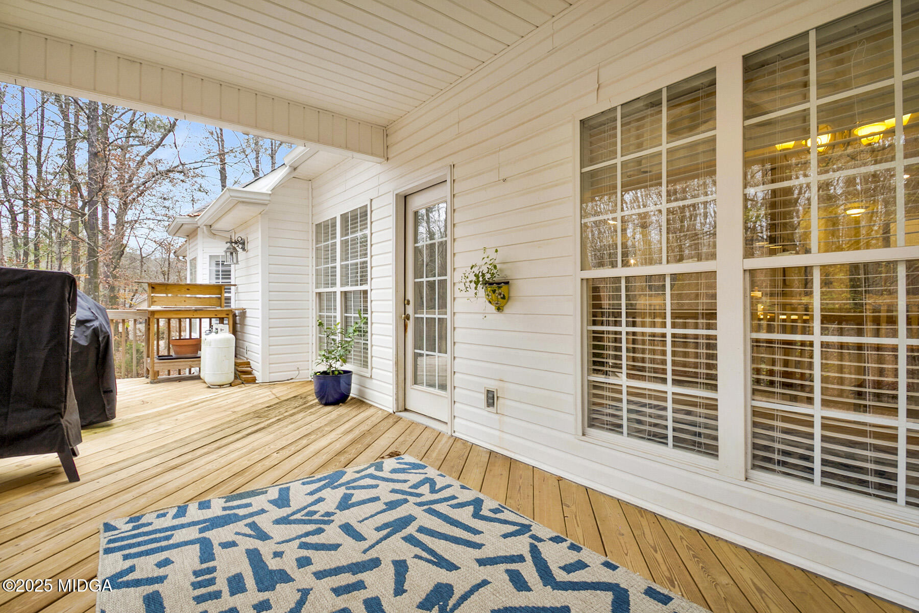 22 Rabon Drive Forsyth, GA 31029 - Photo 40 of 47 a bedroom with a bed and wooden floor