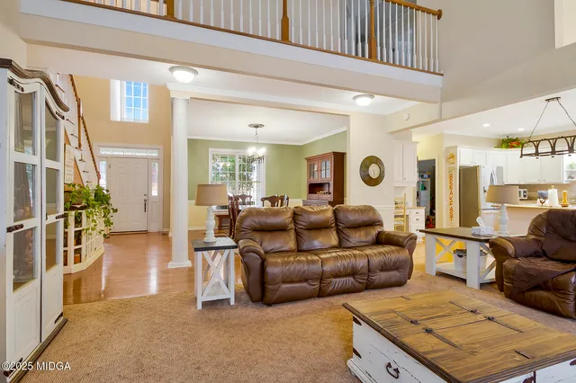 a living room with furniture and a rug
