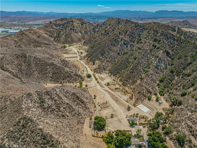 a view of a large building with a mountain in the background