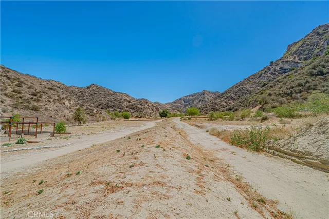 a view of a beach with a mountain in the background