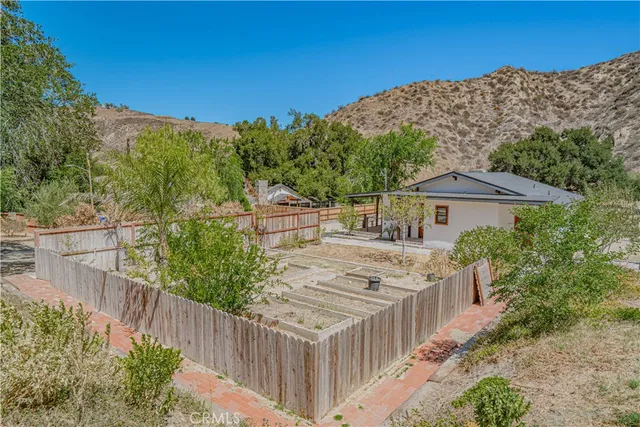 a view of a mountain with a mountain in the background