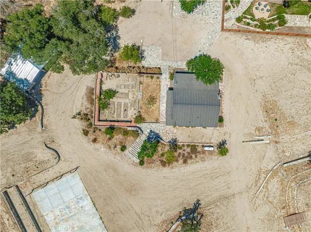 a view of a dry field with mountains in the background
