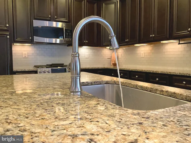 a view of kitchen with wooden floor