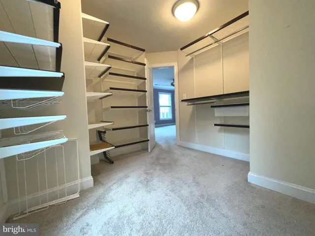 a view of an empty walk in closet
