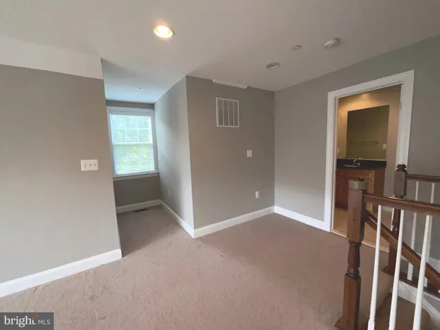 a bathroom with a granite countertop sink mirror bathtub and shower