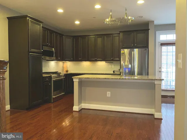 a view of kitchen with wooden floor