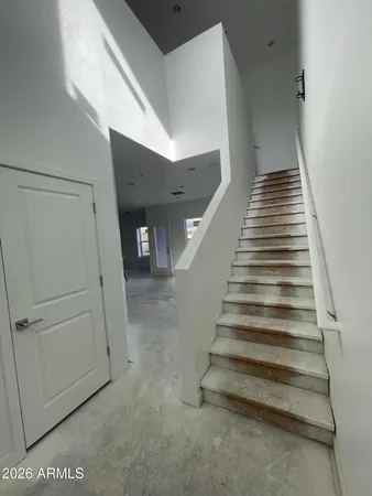 a view of an empty room and a fireplace