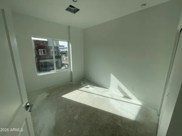 a room with a table and a fireplace