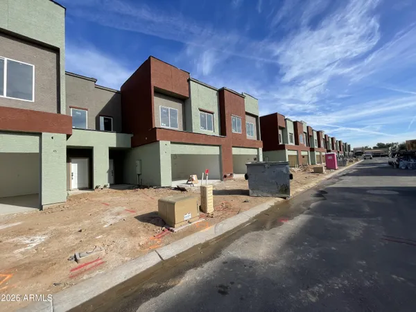 a view of multiple houses with a street