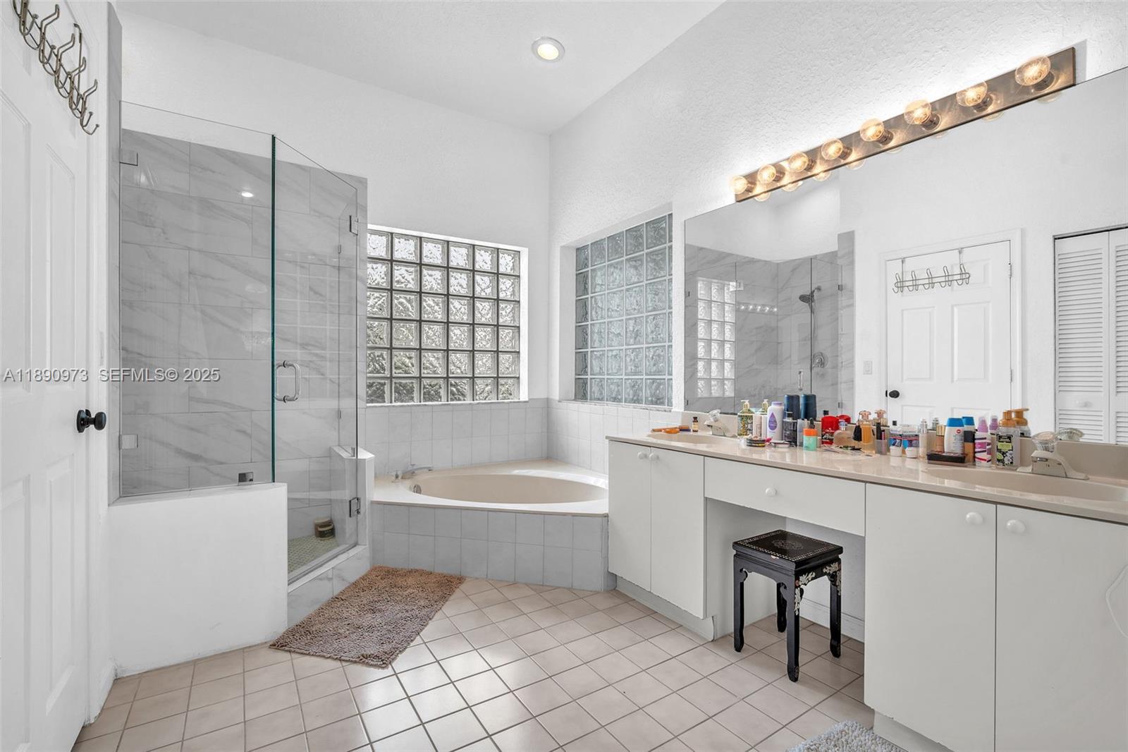 9690 Northwest 39th Street Cooper City, FL 33024 - Photo 17 of 30 a bathroom with a bathtub shower sink mirror and toilet