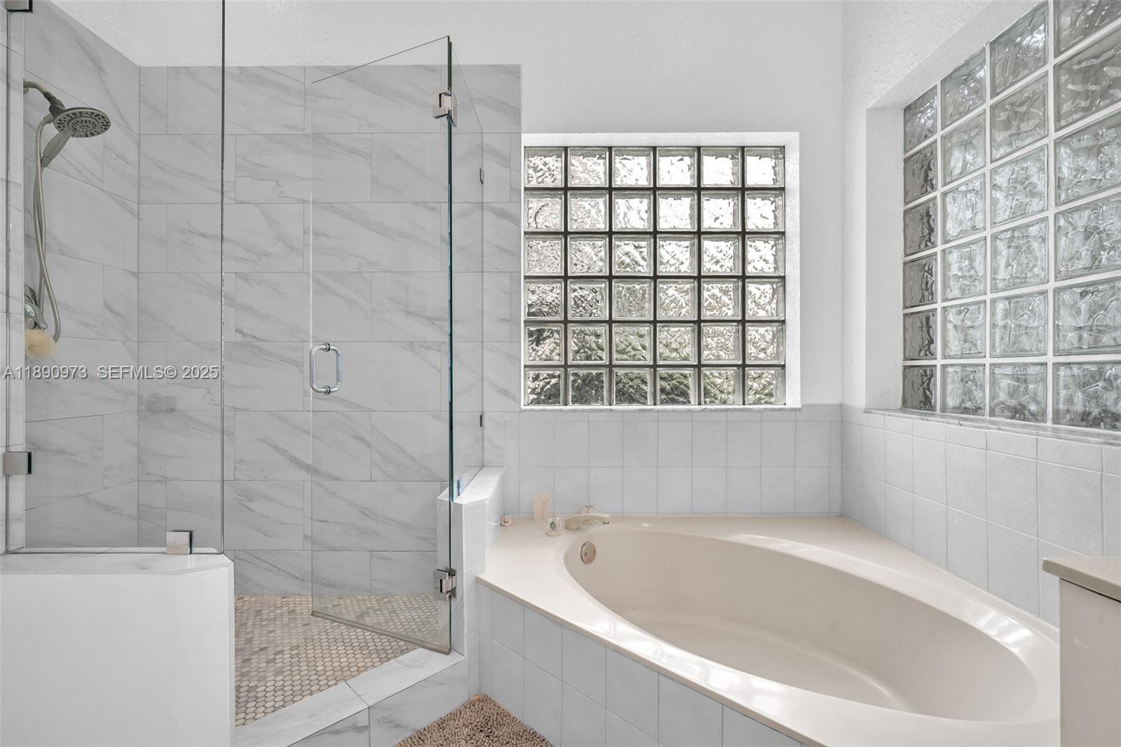 9690 Northwest 39th Street Cooper City, FL 33024 - Photo 18 of 30 a bathroom with a bathtub and shower