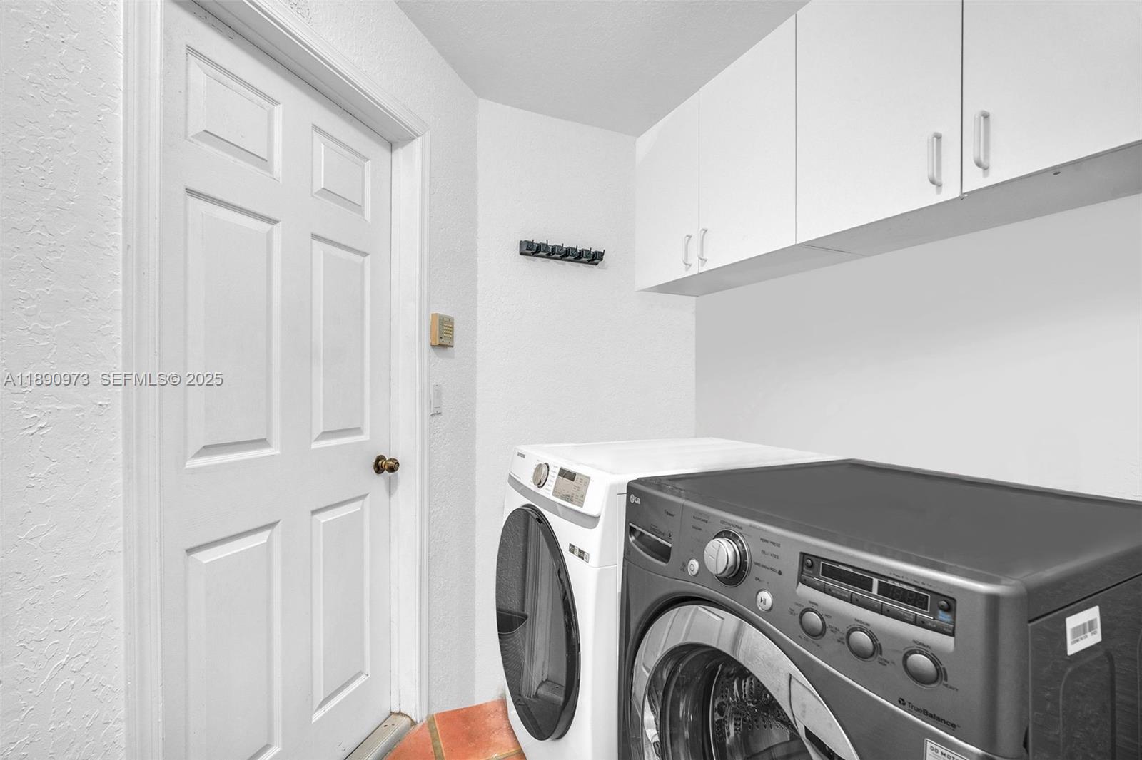 9690 Northwest 39th Street Cooper City, FL 33024 - Photo 25 of 30 a utility room with dryer and washer