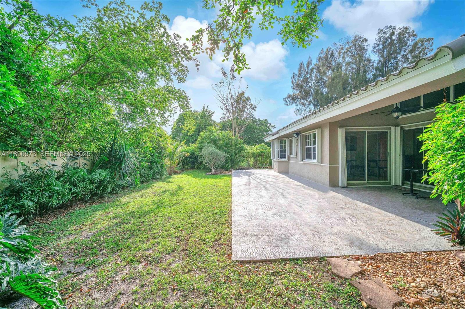 9690 Northwest 39th Street Cooper City, FL 33024 - Photo 30 of 30 a view of a house with a yard and a garage
