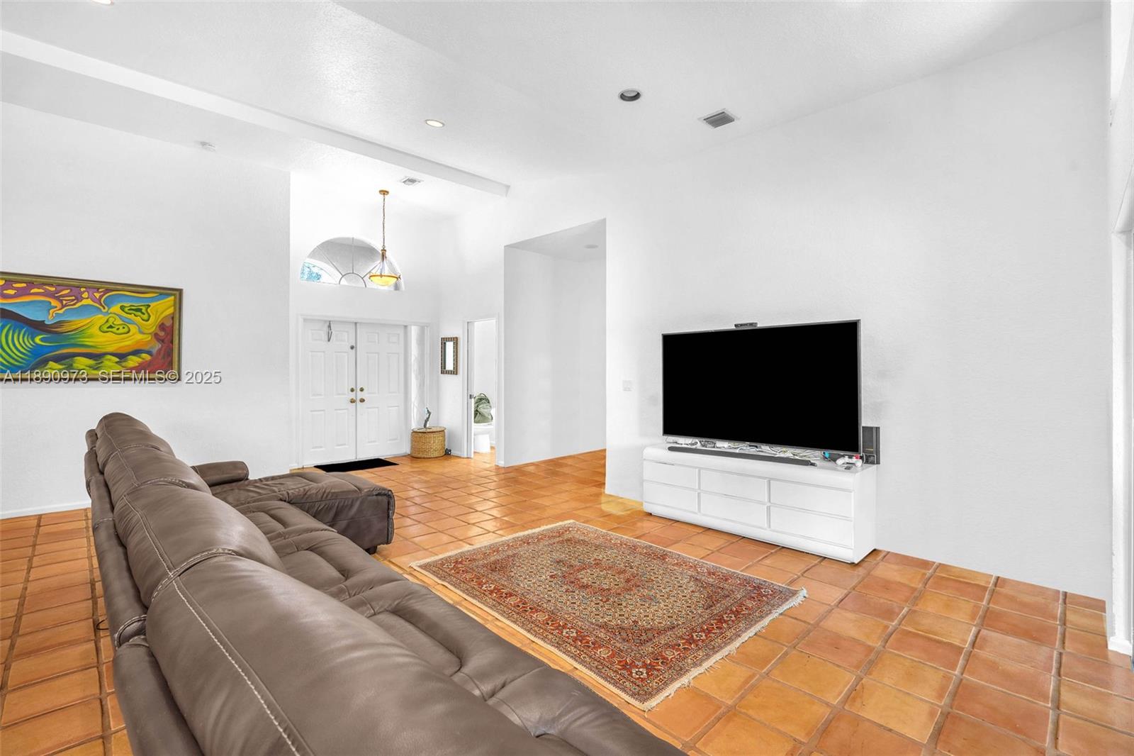 9690 Northwest 39th Street Cooper City, FL 33024 - Photo 4 of 30 a bedroom with a bed and a flat screen tv