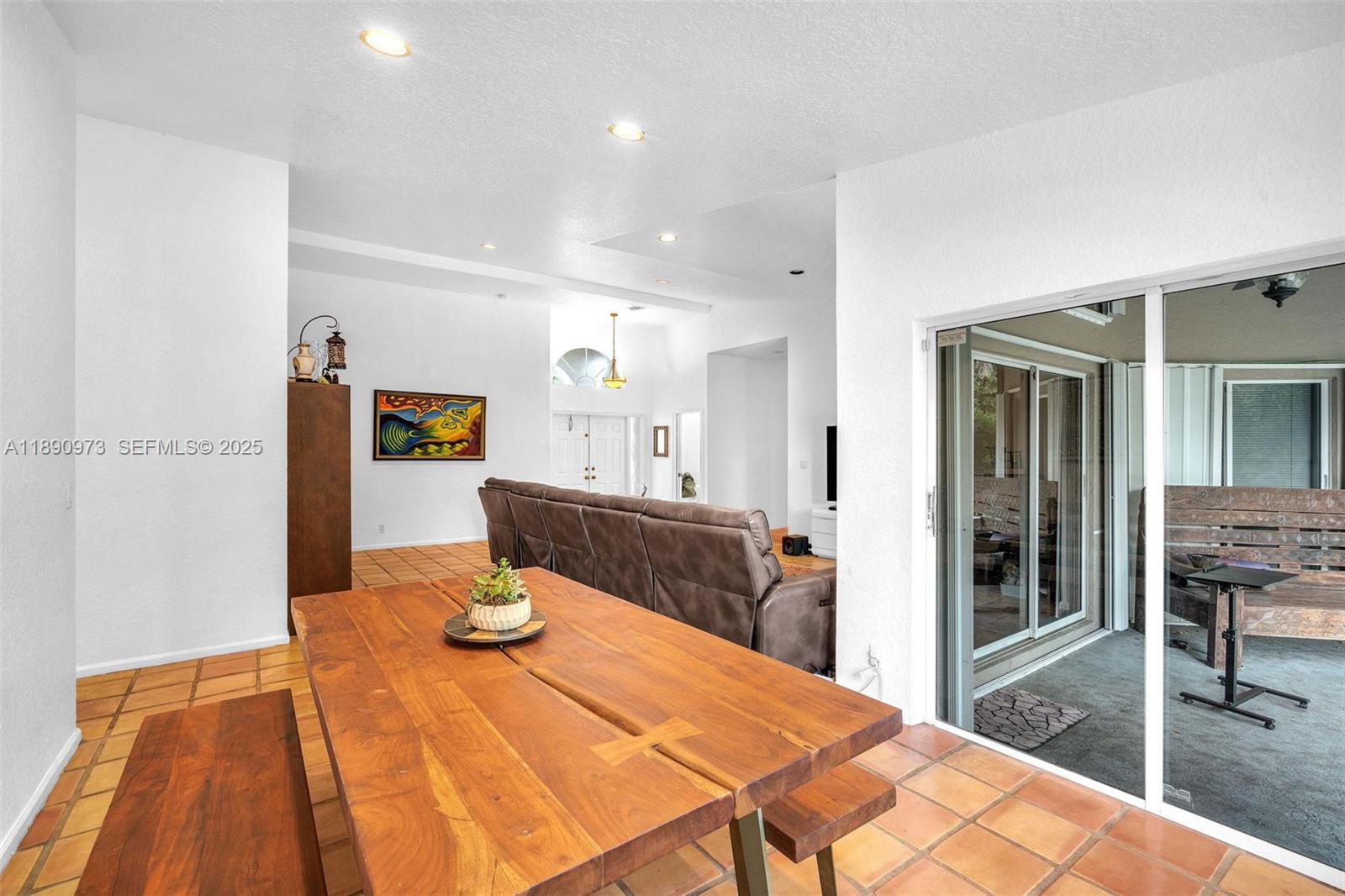 9690 Northwest 39th Street Cooper City, FL 33024 - Photo 7 of 30 a room with a table and chairs